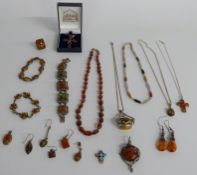 A collection of silver and pressed amber jewellery including bracelets, pendants, earrings etc