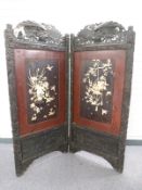 An early 20thC carved wood, mother of pearl, bone and lacquer Shibayama bifold screen, full