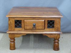 An Eastern hardwood coffee table with two drawers and decorative ironwork, W60 x H41cm
