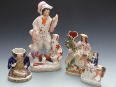 Four 19thC Staffordshire figures including man with hunting dog and game, mounted rider and a