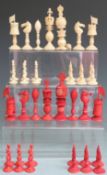 19thC Chinese export ivory 'Burmese' pattern part chess set, stained red and natural, the kings
