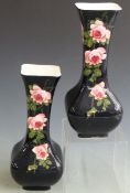 A pair of Bristol/ Pountney George Stewart vases, hand painted with cabbage roses on a blackground