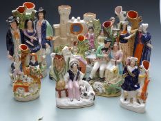 Eleven 19thC Staffordshire figural spill vases including Burns and Mary Welsh, Shepherds etc,