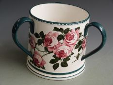 Large Bristol/ Pountney three handled tyg hand painted with cabbage roses on a white background