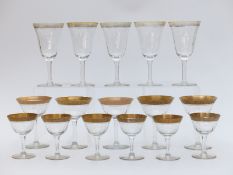 Seventeen Moser drinking glasses, all with floral decoration to the gilt rims and gilt feet,