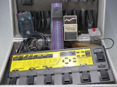 Boss ME-8B bass multiple effects guitar unit with power supply, together with a bass equalizer,