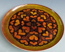 Poole Pottery retro charger decorated in Aegean pattern and signed by Diana Davis, diameter 32cm