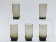 A Whitefriars style lemonade set with five glasses and a jug glasses, all in smoke grey.