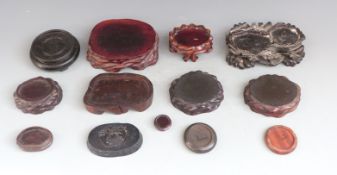 Thirteen 19th/20thC Chinese hardwood stands, largest 17 x 11cm