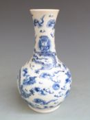 A 19thC Chinese blue and white vase with dragon decoration, 21cm tall