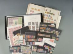 A book of all world stamps including China, an interesting folder of forgeries, reprints etc and