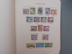 An extensive collection of QEII Commonwealth stamps in nine New Age albums, mainly used with many