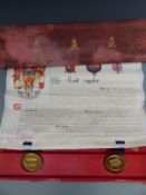 George V tooled leather cased grant of arms relating to Sir William George Tyrrell, with two