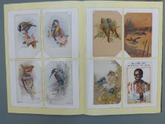 An album of postcards to include humorous, dogs, WWI embroidered, birds, Newmarket etc