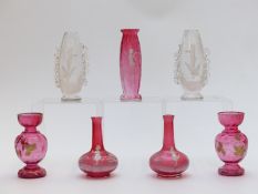 Five pieces of Mary Gregory glass together with a pair of Moser style enamel and gilt cranberry