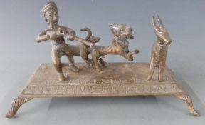 Eastern brass figural hunting group raised on footed base, H11cm, L23cm