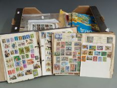 A box containing a large quantity of presentation pack first day covers in loose stamps and albums