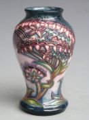 Moorcroft signed pedestal vase decorated with flowers against a lilac ground, boxed, H9.5cm