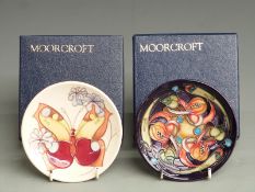 Two Moorcroft pin dishes in boxes, one signed and dated 2002, the other 1993 diameter 12cm