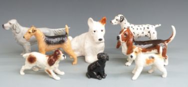 Eight Beswick dog figures including seated Sealyham, tallest 17cm
