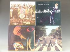 Approximately 25 albums including The Beatles and E.L.O.