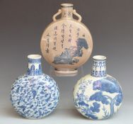 Two Chinese blue and white moon flasks and a Chinese crackle glaze moon flask with script and