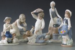 Five Nao figures including two boys play fighting, tallest 29cm