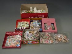 A large quantity of all world stamps, loose and in packets