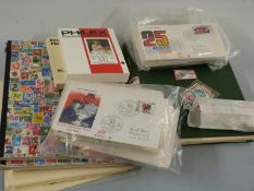A collection of German stamps comprising an album, two stockbooks, loose album pages, first day