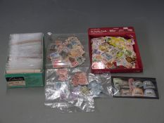 A large quantity of old world stamps, mainly in packets