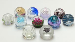 Eleven Caithness limited edition glass paperweights, all with certificate of authenticity