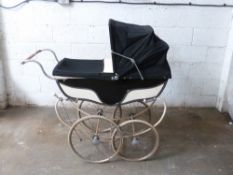 Marmet coach built pram with sprung suspension, navy and cream coachwork and hood, height to