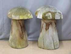 Two carved oak mushroom/ garden ornaments, tallest 77cm