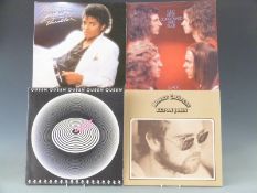 Approximately 130 albums including Michael Jackson, Elton John, Queen, Slade, Simon and Garfunkel