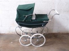 Silver Cross coach built dolls pram with green bodywork and hood, height to handle 76cm