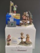 Five Goebel figures including advertising and larger figural groups, some boxed