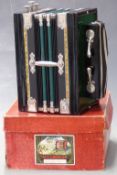 German made three stop melodeon/ accordeon with 10 treble buttons and two spoon bass in the key of