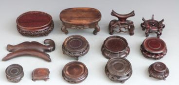 Thirteen 19th/20thC Chinese hardwood stands, longest 14 x 8cm