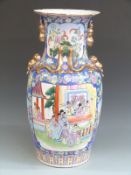 A large Chinese floor vase decorated with court scenes, 61cm tall