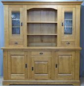 Contemporary light oak dresser with an arrangement of cupboards and drawers, W200 x D54 x H220cm