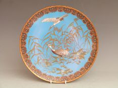 A 19thC Japanese cloisonné charger with crane decoration, diameter 30.5cm