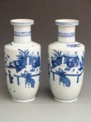 A pair of Chinese blue and white rouleau vases with Qianlong mark to base, 40cm tall
