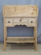 A small pine wash stand with three drawers, under shelf and gallery back, W76 x D38 x H100cm