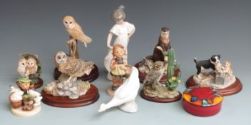 A collection of Border Fine Arts, Nao and Hummel figures, tallest 22cm
