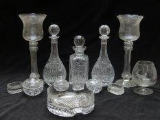 Thirteen pieces of clear glassware including salts, fruitbowl, decanters, large candle holders