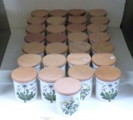 Seventeen Portmeirion storage jars, including a graduated set of three, all decorated in Botanic