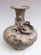 Japanese bronze vase with applied flower decoration and impressed signature to base, H23cm