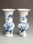 A pair of Chinese blue and white vases with Kangxi mark to base, 41cm tall