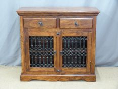 An Eastern hardwood small sideboard with decorative ironwork doors, W100x D46 x H90cm