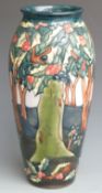 Moorcroft large signed baluster vase decorated with holly and berries, dated 1997 and initialled